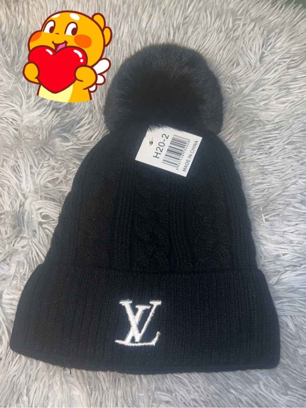 Black Cable Knit Pom Beanie with LV Logo Perfect for winter; it is very warm.